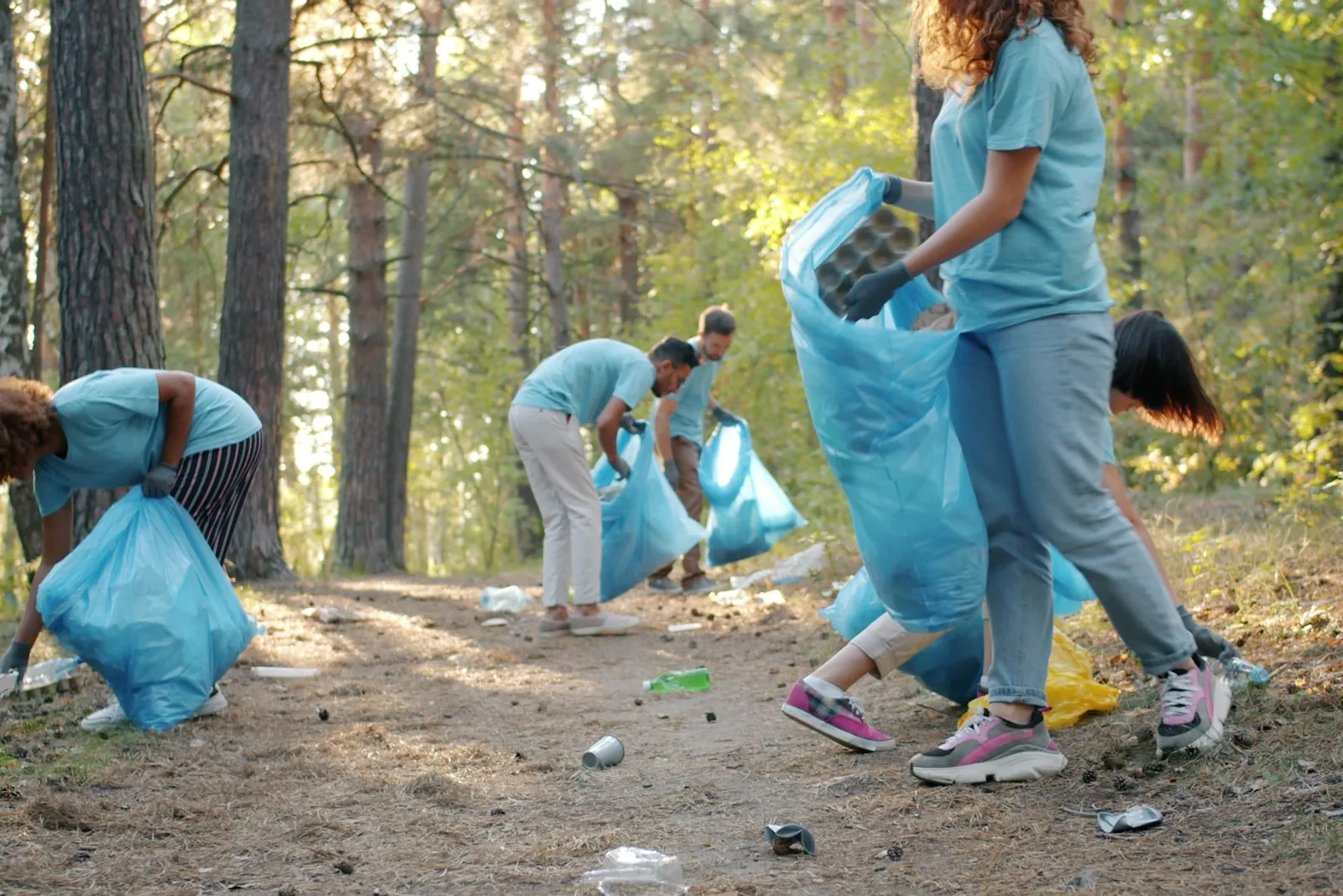 Friends volunteering together outdoors